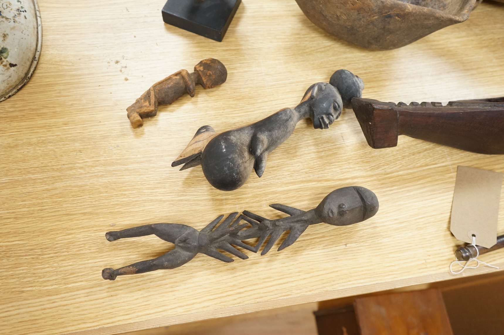 Tribal interest; A collection of various African carvings, a basket and spear